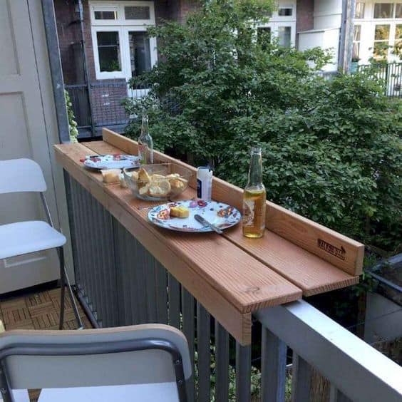 table on the ledge on a small balcony